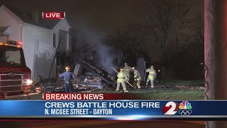 Crews battle house fire in Dayton