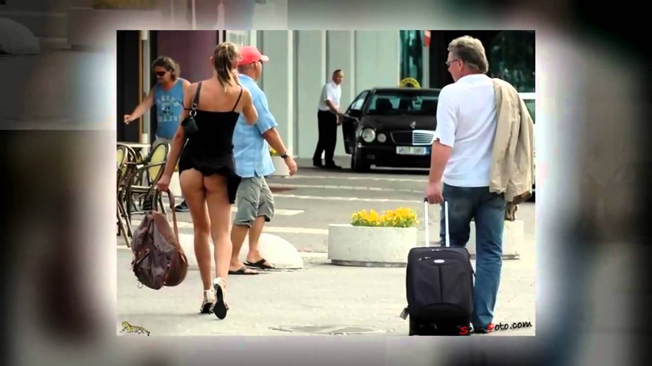 Парень подходит к девушкам и заглядывает им под юбки Парень подходит к девушкам и заглядывает им под юбки