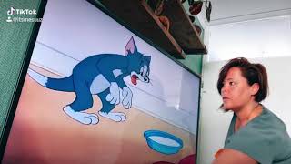 Tom and Jerry stealing his milk