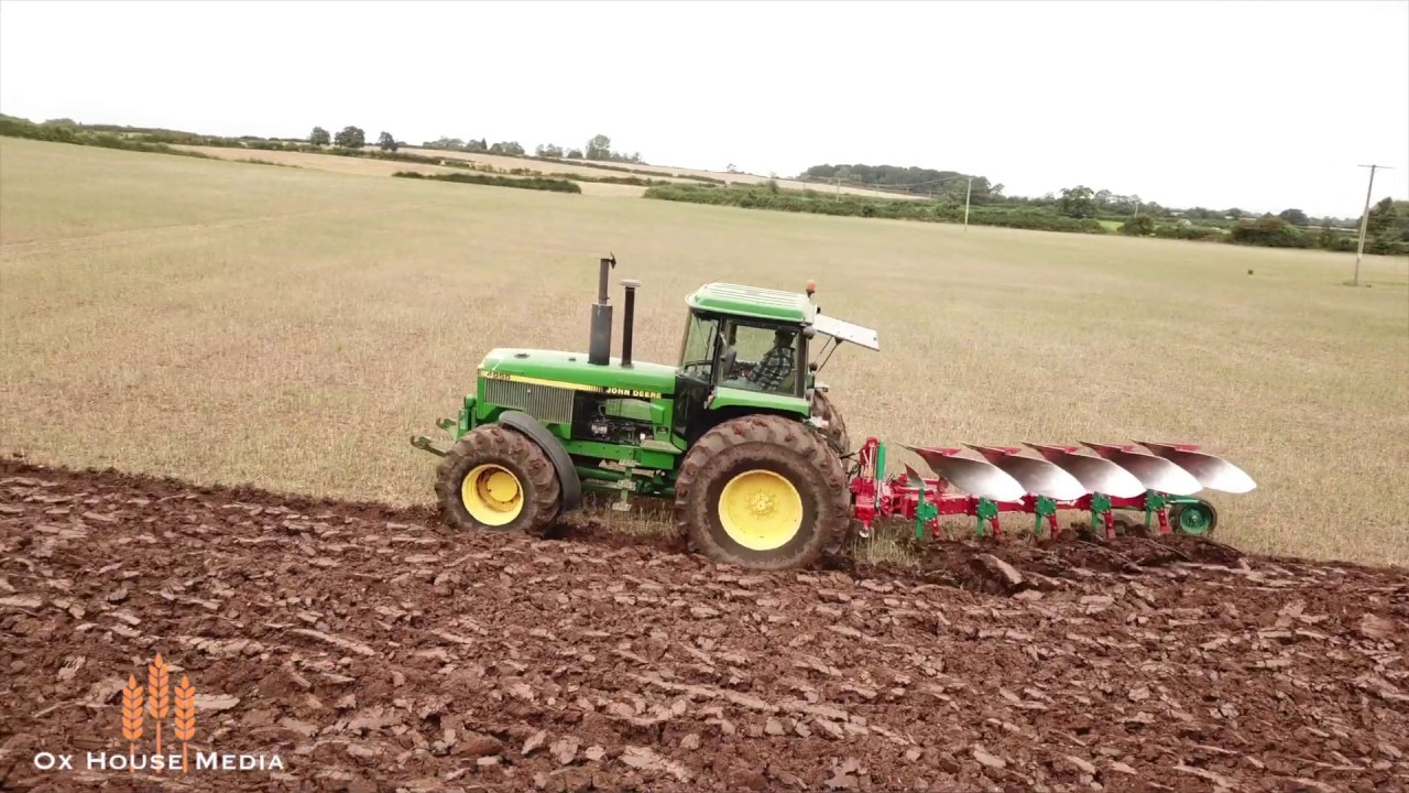 John Deere 4955 ploughing