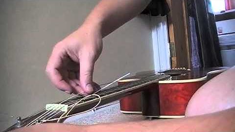 Restring acoustic guitar/remove bridge pin tip