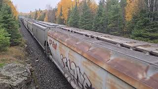 Eastbound CPKC grain train 320 luggs up the grade into Ingolf on Thursday, October 15th, 2026. Eastbound CPKC grain train 320 luggs up the grade into Ingolf on Thursday, October 15th, 2026.