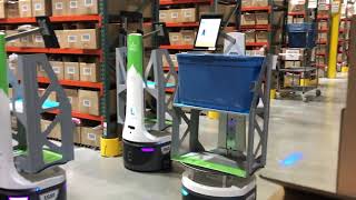 Autonomous Mobile Robots (AMRs) moving through the warehouse