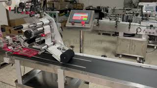 pouch paging and sticker labeling machine|YQ plastic bag label applicator with auto stacker feeder