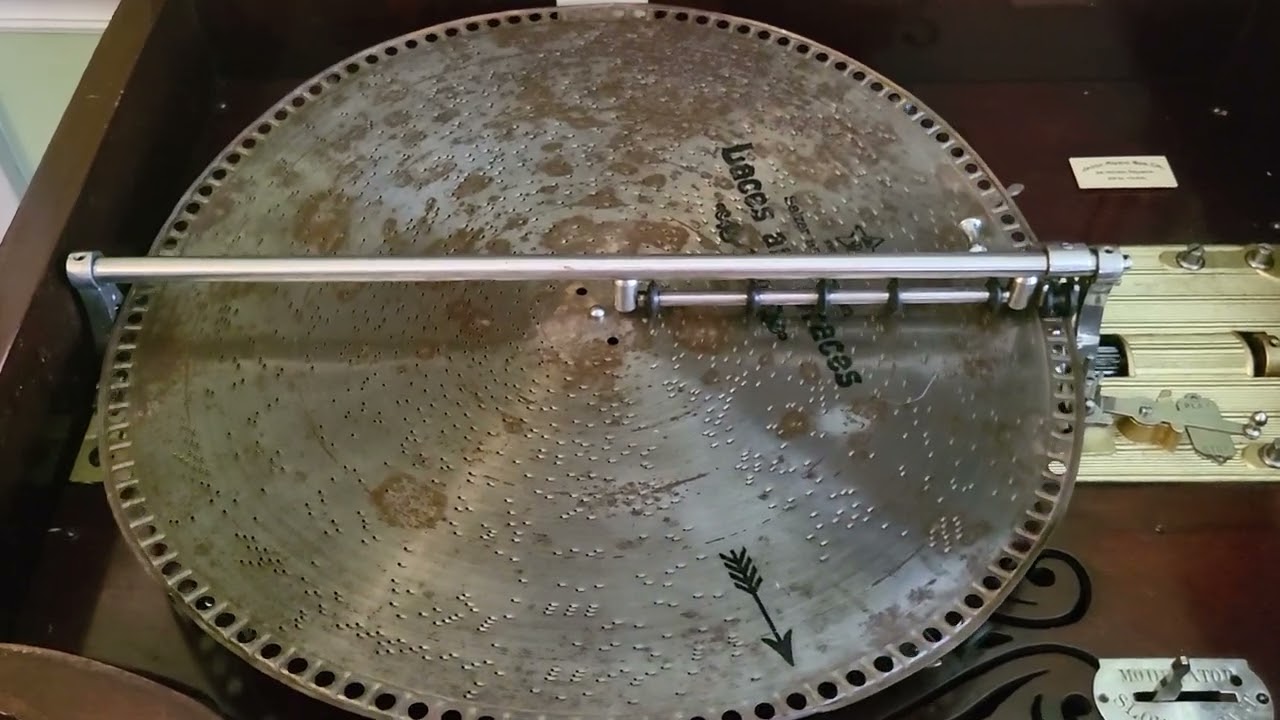 Mira 18.5" music box plays disc 1049, "Laces and Graces"