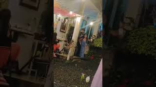 Woman Trips on Heels and Falls to Her Knees Behind Singer