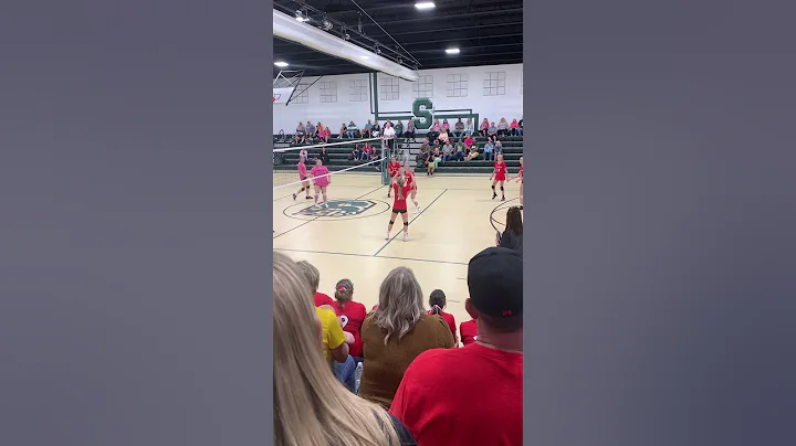 Claire Schafer #9 / tips the ball down