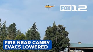 Evacuation orders lowered as crews get control of fire near Canby