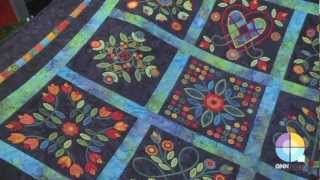 Sharon Pederson at Quilt Market presenting her Aurifil 's collections