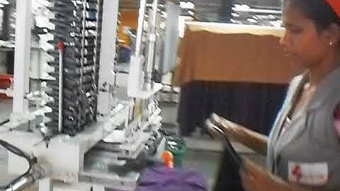 Apparel: Hanger attach automation