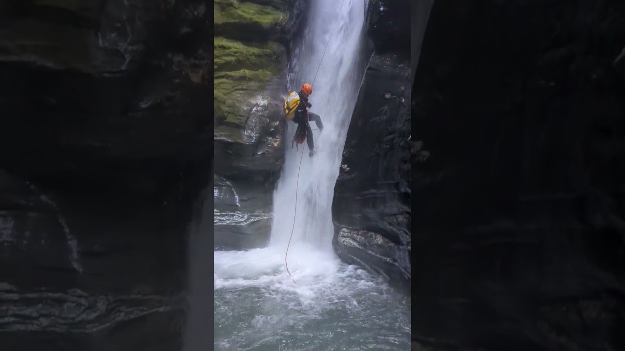 pro canyoner making easy work of a spicy rappel