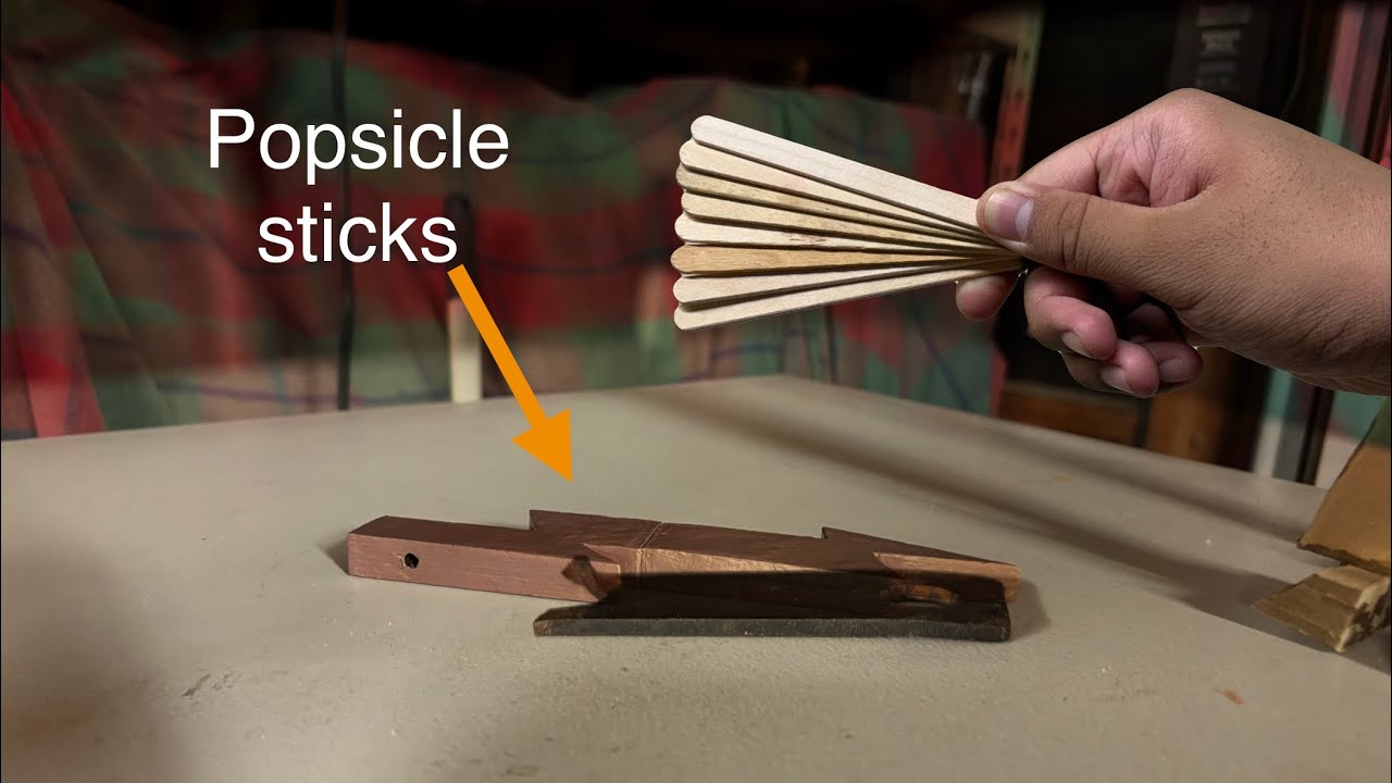Making a Purple lighting bolt out of popsicle sticks with hidden blade