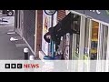 TikTok fame for woman dangling from shop shutters | BBC News