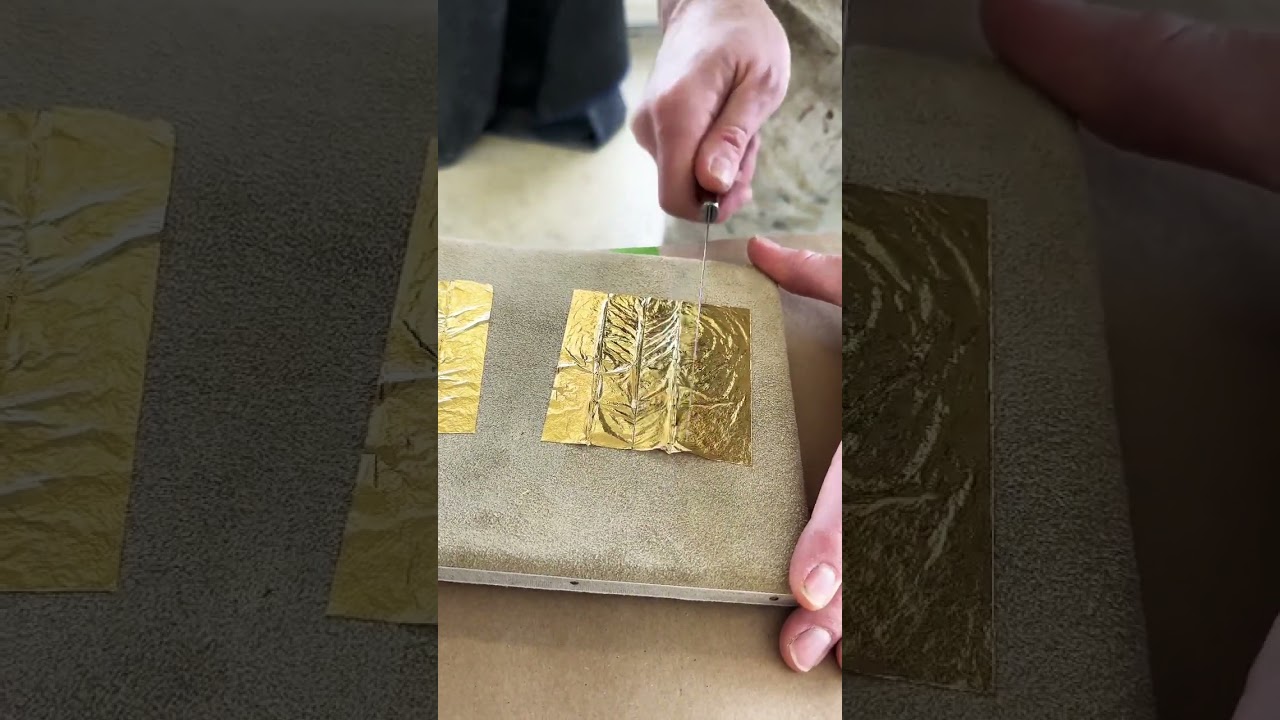 Cutting 23k gold leaf with laser ruler eyes  