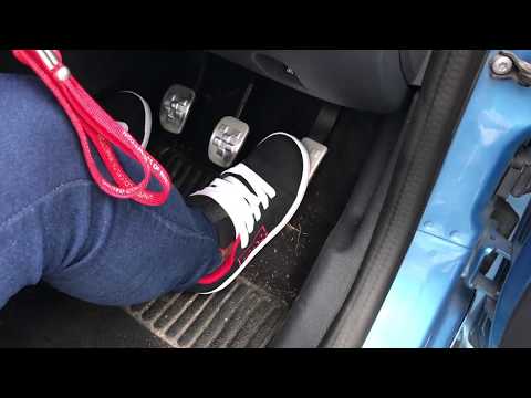 Kate is driving in DC skate shoes