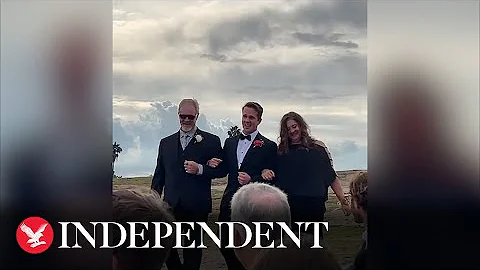 Group of high school students surprise teacher by crashing his wedding