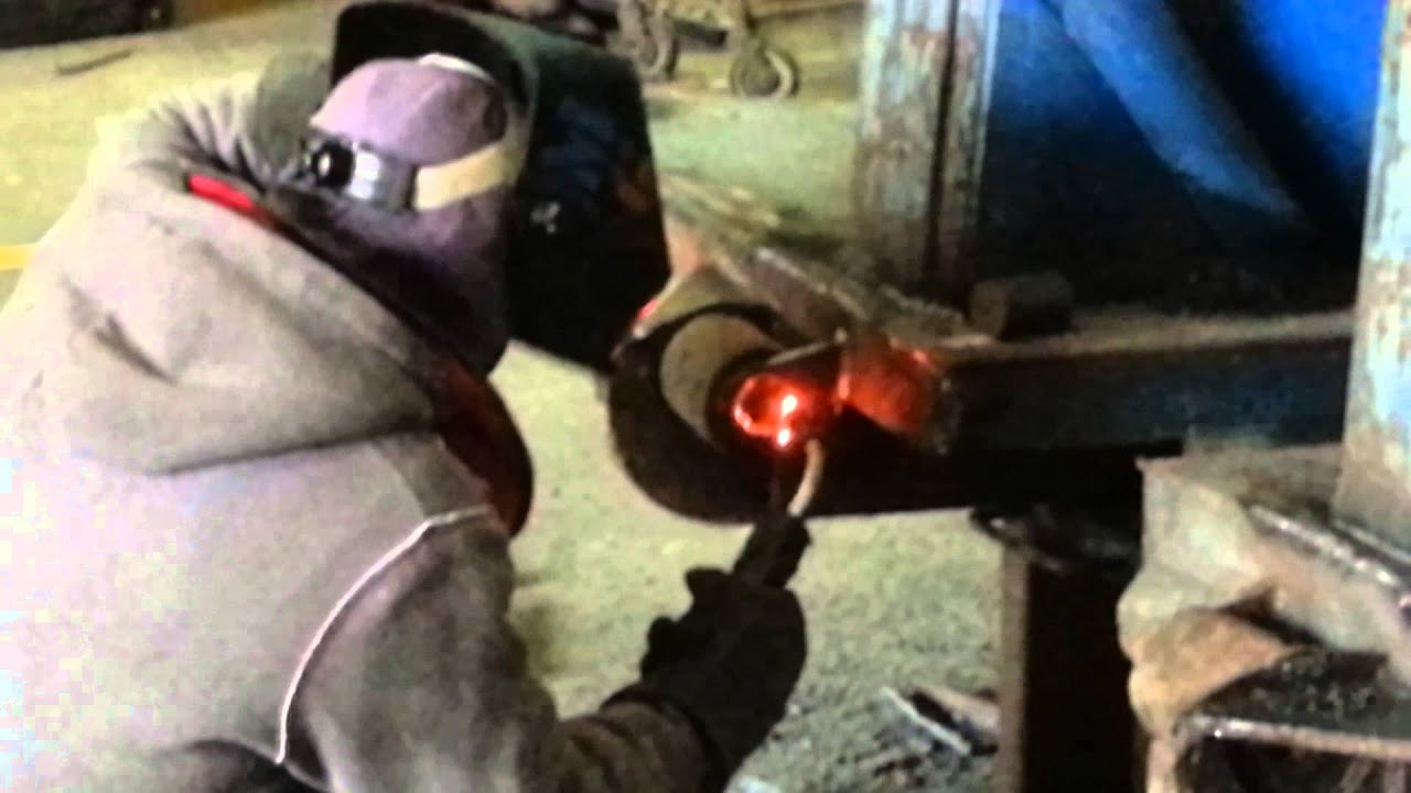 Dumpster Refurbishing - Welding New Nose Roller on 40-Yard Roll-Off