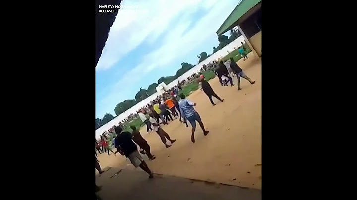 Large group of people gathering during riot in Maputo prison, Mozambique