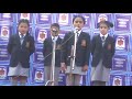 Cute little students singing a poem