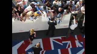 Benedict Cumberbatch giving autographs at BAFTA 2012 red carpet