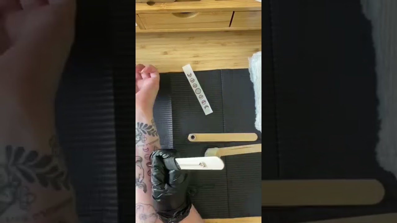 Stick and poke tattoo of the moon cycle. 