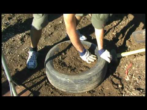 Tyres #2: Hand packing, jumping and kicking - CERES Earthships Australia