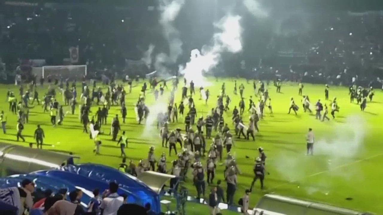 Mass tragedy in Indonesia after fans of two rival soccer teams stampede onto field