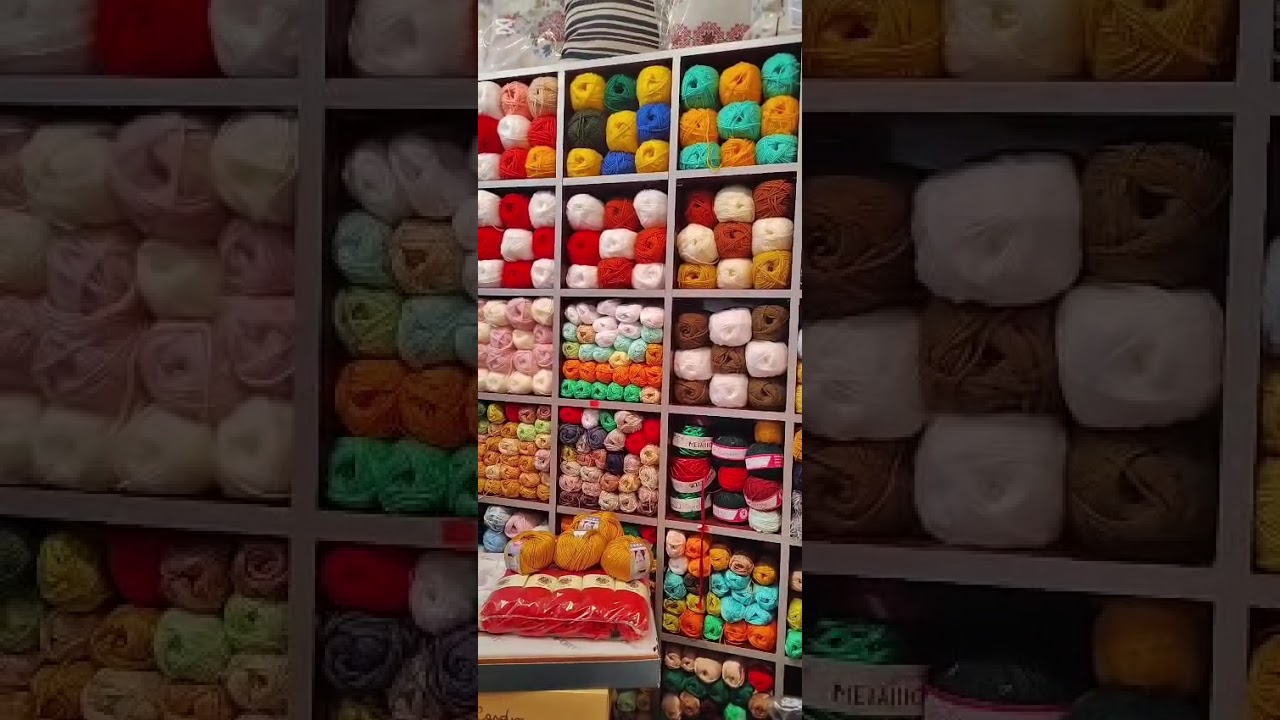 In România  la un magazin de fire,nasturi, fete de masa 