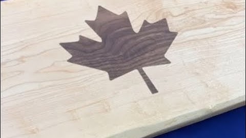 Maple charcuterie board with walnut inlay.