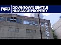 Seattle hotel blames abandoned building next door for crime, fires, guest complaints