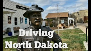 Driving from Miles City Montana to Jamestown North Dakota, visiting small towns and roadside sites.