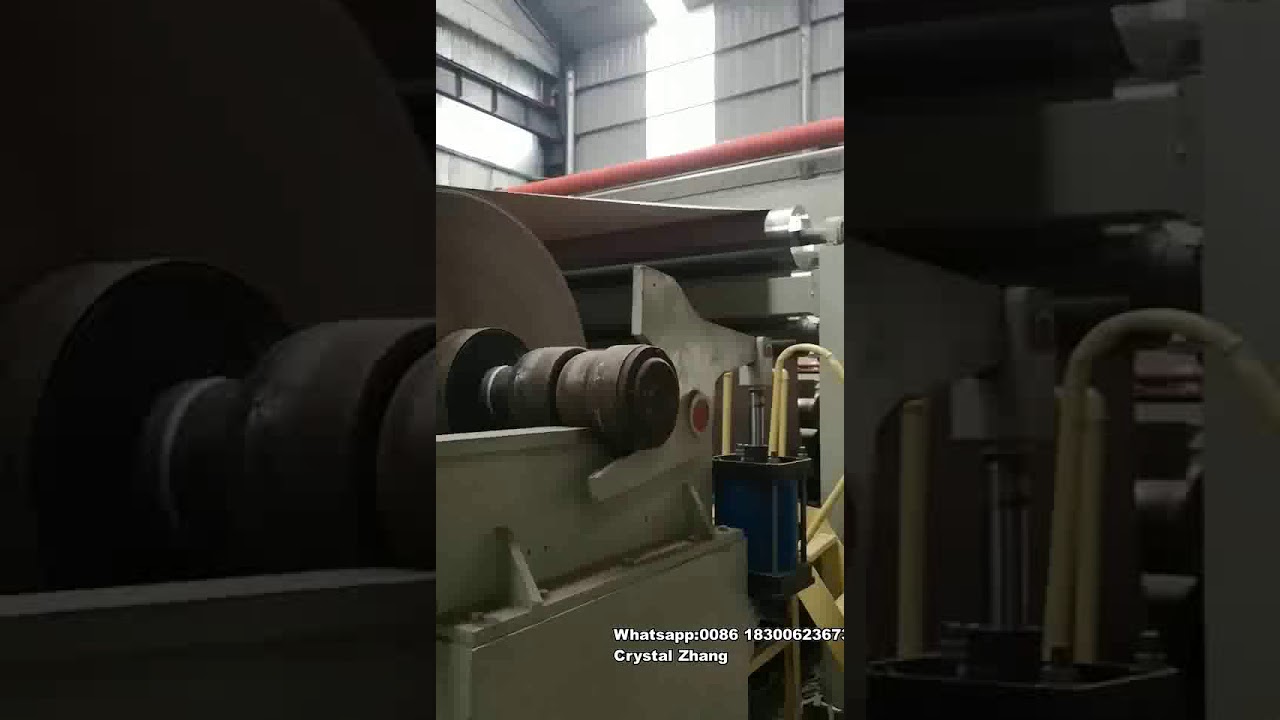 Bottom feeding rewinder machine