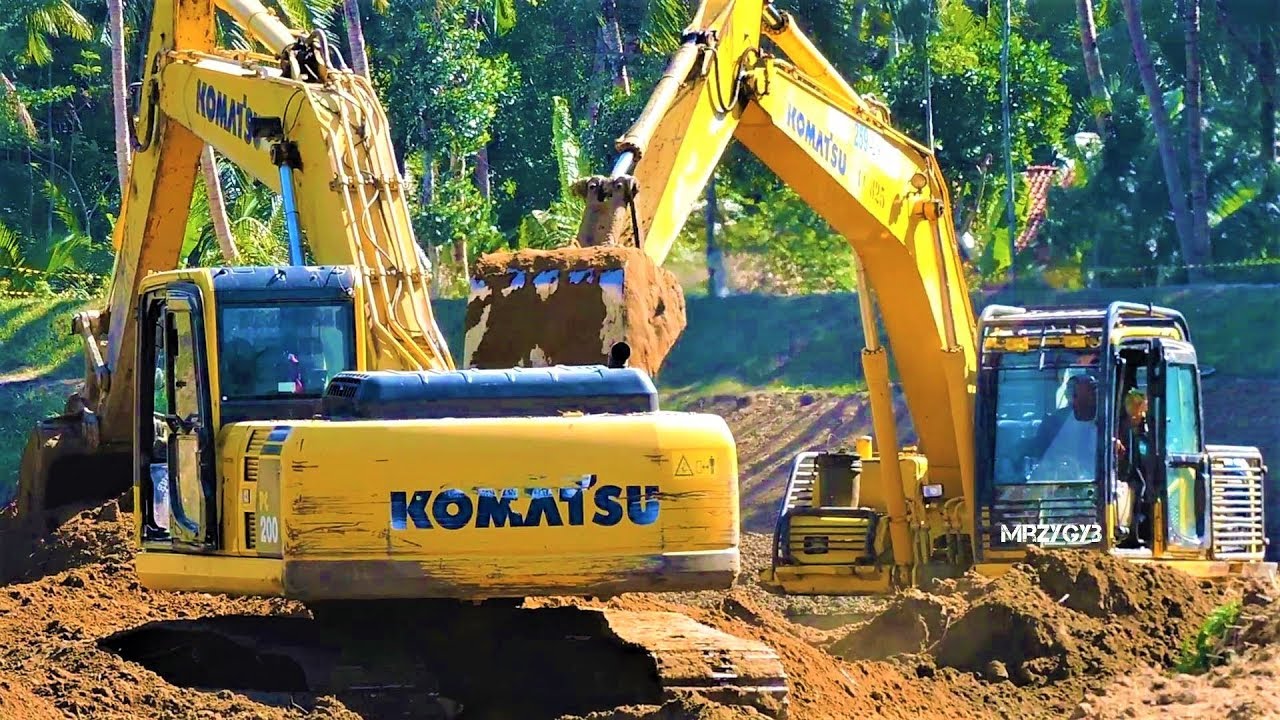 Excavators Digging Swinging Dirt At The River Bank Komatsu PC200 - YouTube