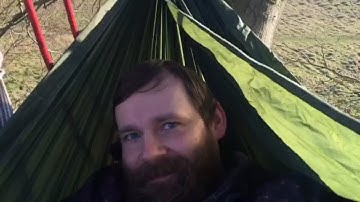 Setting a hammock high up on a tree