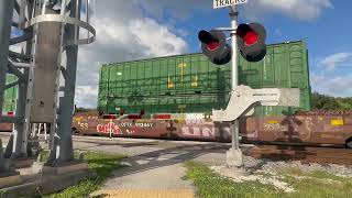 FEC ES44AC pulls intermodal and truck trailers. Car almost got hit
