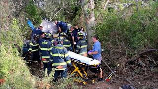 CAR CRASHES OFF LONG ISLAND EXPRESSWAY TRAPPING DRIVER IN YAPHANK NY