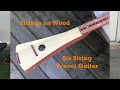 Spencer scharf on strings on wood travel guitar