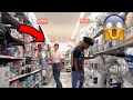 THROWING RICE ON RANDOM PEOPLE IN WALMART! (THREW RICE ON A WORKER!)