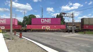 CPKC 113 intermodal stack train meets CN freight at Islington & Steeles.