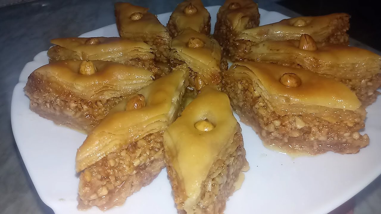 وصفات طبخ حلويات/بقلاوة الجزائرية بدون الة التوريق تجي مورقة بطريقة سريعة جدا واسهل منها مكانش