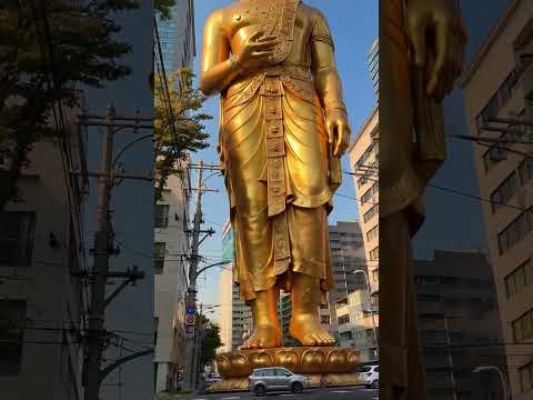 Golden Buddha Statue Walking City Streets