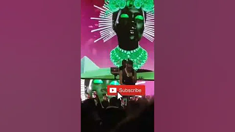Wizkid takes a fan's phone from the audience and record