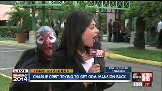News reporter interrupted by masked man