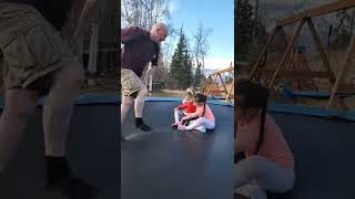 Cute Girls And Daddy Jumping In The Trampoline