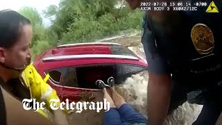 video: Watch: Terrifying moment woman is rescued from car trapped in Arizona floods