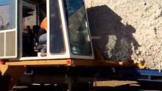 Hylander Unloading Cotton Module off Flatbed Truck