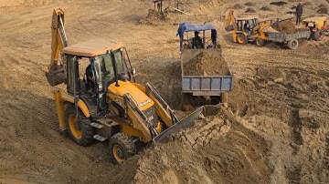 Jcb machine collecting soil loading into mahendra, sonalika, john dare tractors @roadtrendmachinework