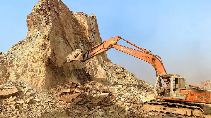 "Massive Rock Break with Excavator: Excavator's Power and Precision in Action"The excavator powerful