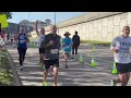 Lincoln Marathon runners pass the finish line as over 7,000 people participate in 49th annual eve...