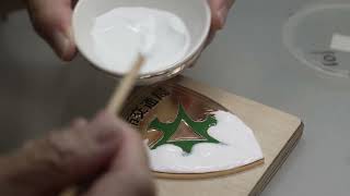 Process of making the Cloisonné emblem of Kyoto City. A handmade emblem by Japanese craftsmen.
